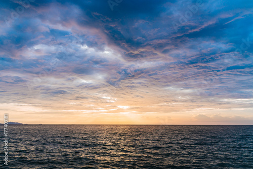 Sunset sky background on the beach. © Hide_Studio
