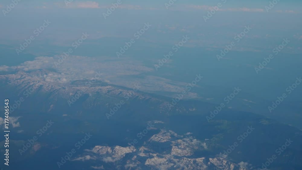 View from the window of the plane flying over clouds. 4K View from the window of the plane flying over clouds. 4K