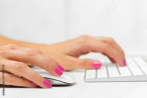 Woman's hands on a keyboard