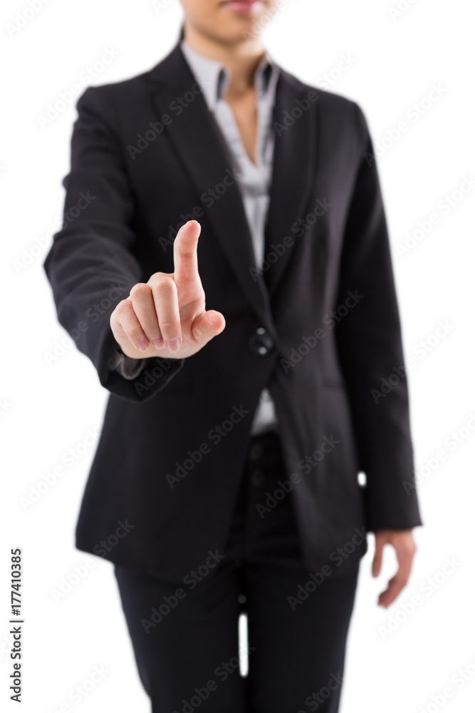 Businesswoman pressing an invisible virtual screen Businesswoman pressing an invisible virtual screen