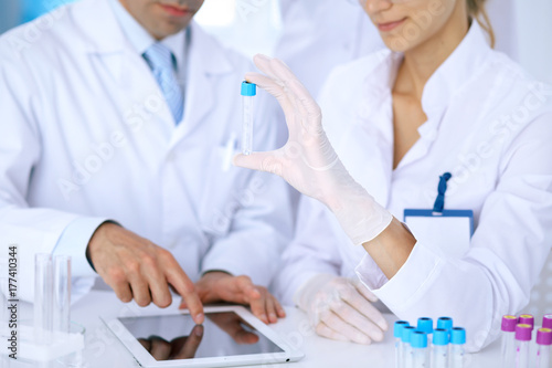 Wallpaper Mural Team of  scientific researchers in laboratory studying substances or blood sample. New vaccine for pharmacology industry is s almost ready. Medicine and science concept Torontodigital.ca