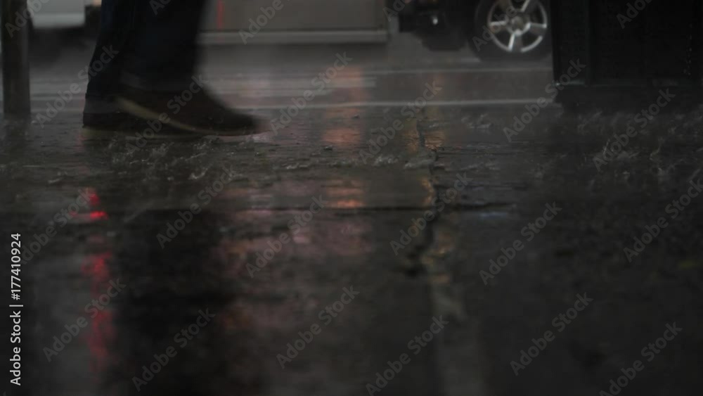 Heavy rain hitting streets of New York City. Slow motion.