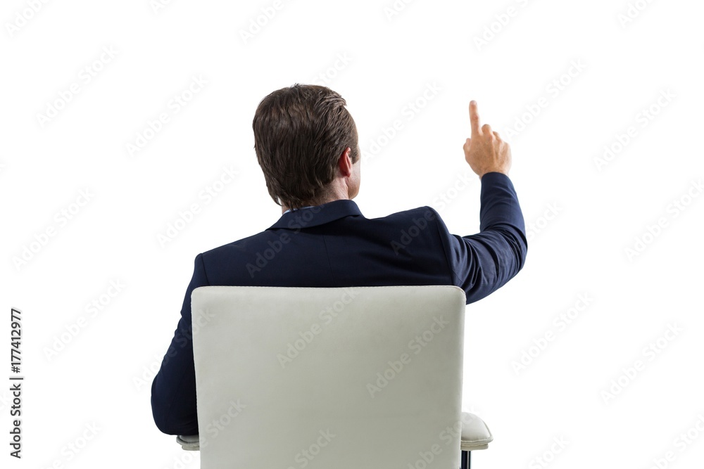 Businessman pressing an invisible virtual screen Businessman pressing an invisible virtual screen