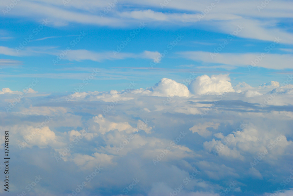 Flying over the clouds in airplane with beautiful blue sky. Flying over the clouds in airplane with beautiful blue sky.