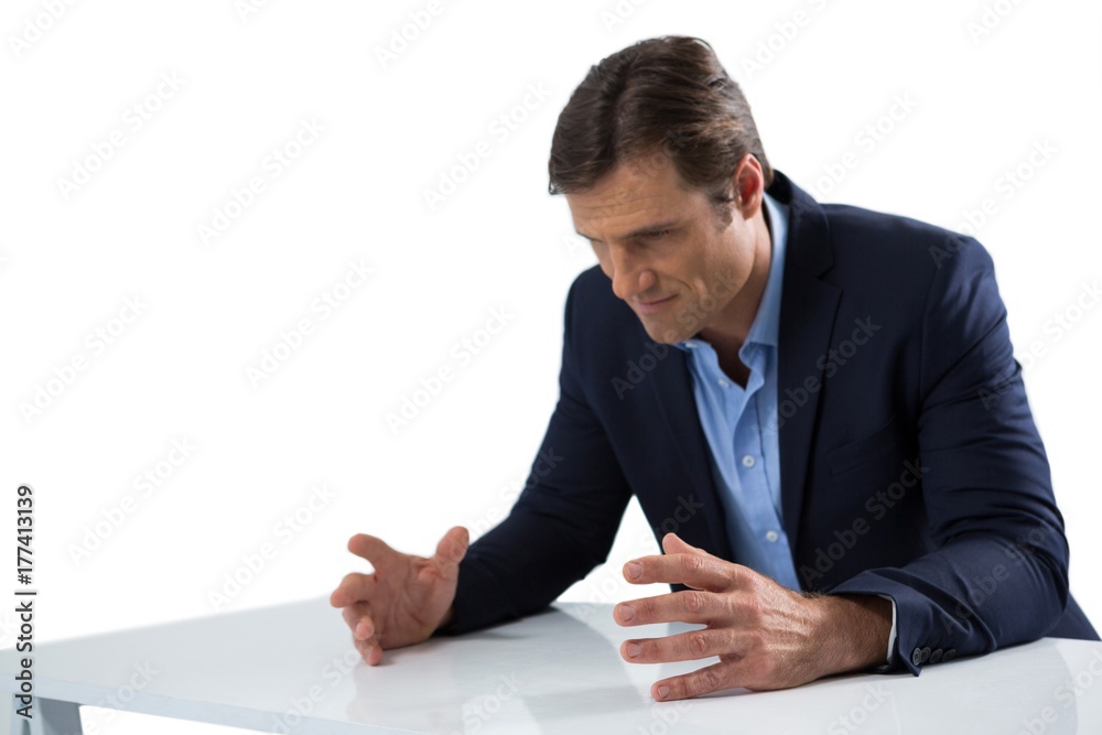 Frustrated businessman gesturing against white background Frustrated businessman gesturing against white background