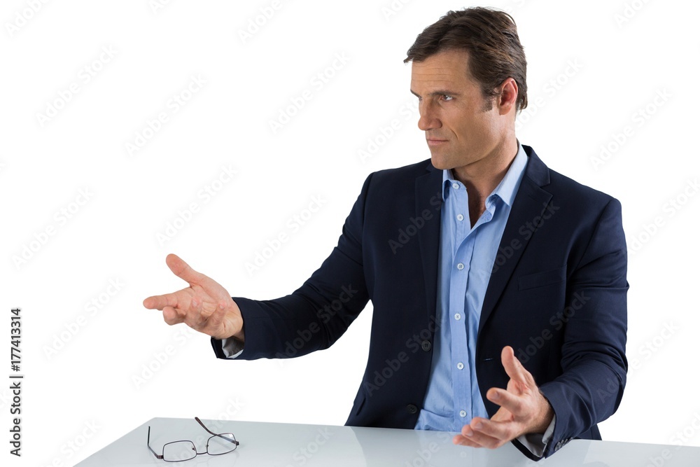 Businessman gesturing against white background Businessman gesturing against white background