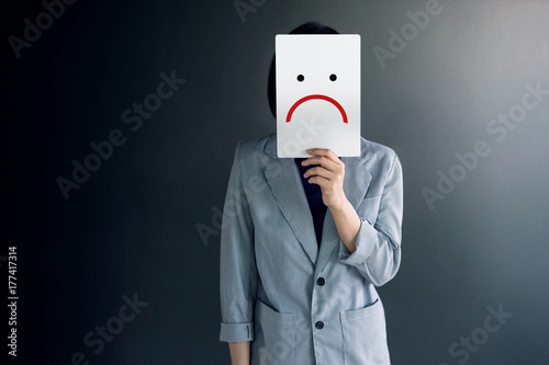 Customer Experience Concept, Portrait of Client with Feeling Disappointed Face, Drawn Emotion on Paper photo
