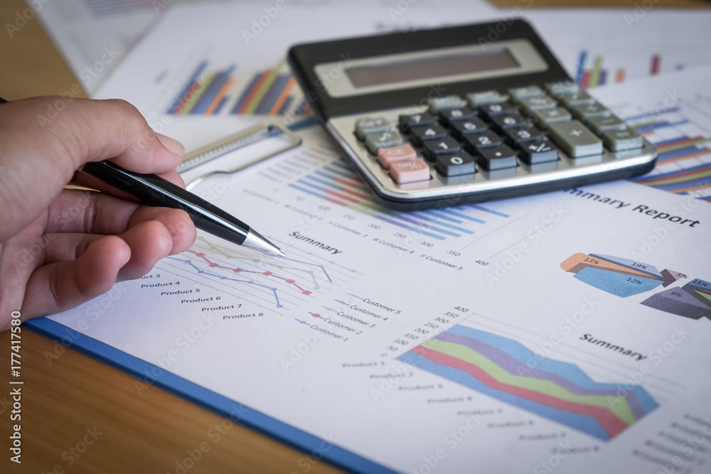 Businessman working with calculator at office,Finance managers task,Concept business and finance Businessman working with calculator at office,Finance managers task,Concept business and finance
