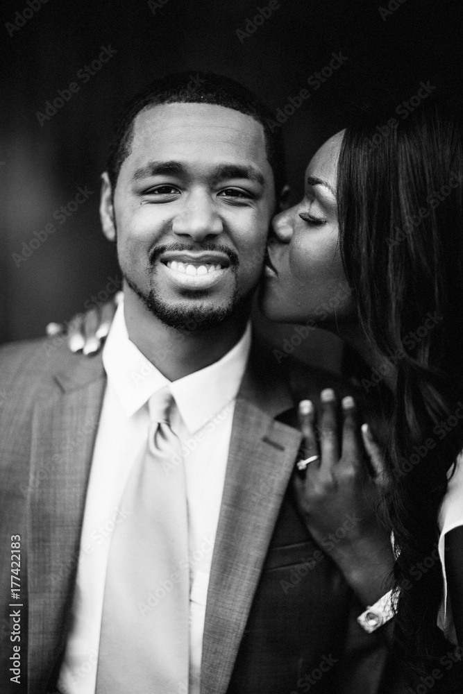 A kiss on the cheek from wife to husband A kiss on the cheek from wife to husband