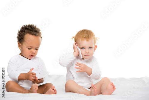 multicultural toddlers with digital smartphones