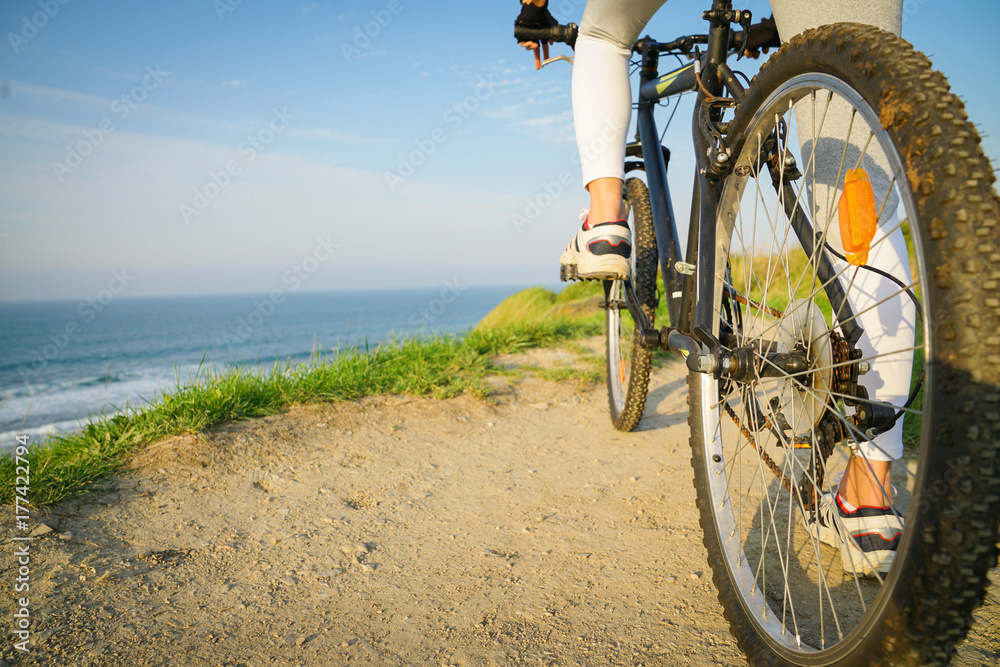 Fototapeta premium Enjoying a relaxing biking ride on the seaside
