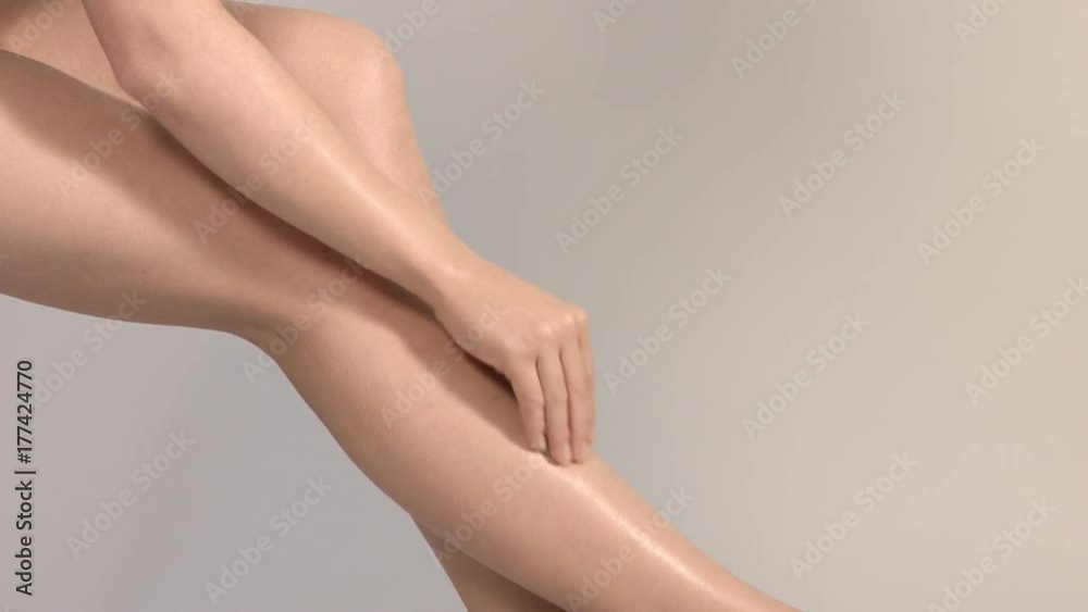 Beautiful female legs overgrey background. Beautiful female legs overgrey background.