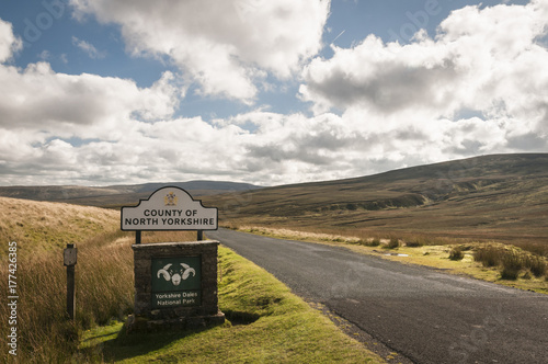 County Border. The border road sign between the counties of Cumbria and North Yorkshire across Birkdale Common, England.