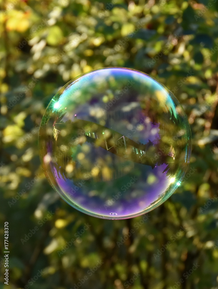 The reflection of a house in a soap bubble The reflection of a house in a soap bubble
