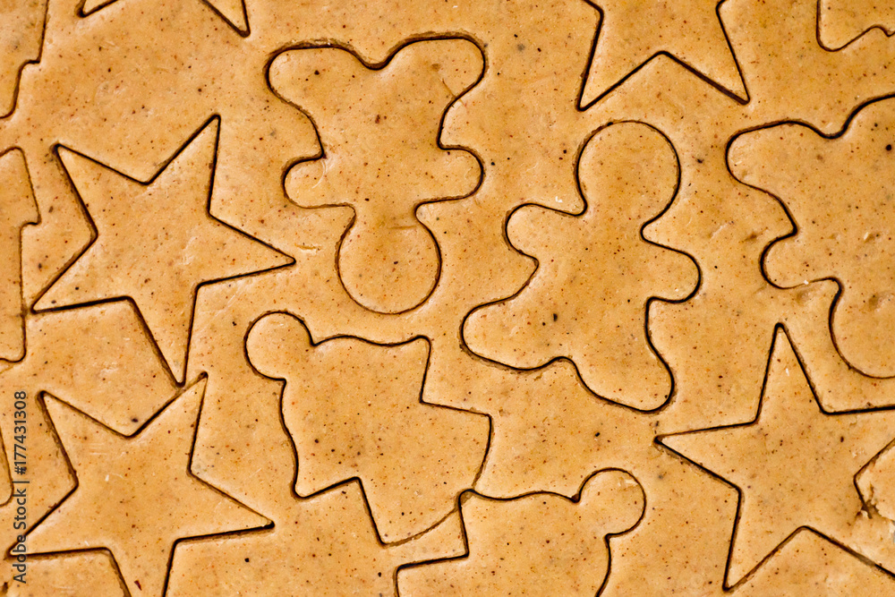 Preparing dough for baking gingerbread cookies background - baking, cooking, christmas and food concept Preparing dough for baking gingerbread cookies background - baking, cooking, christmas and food concept