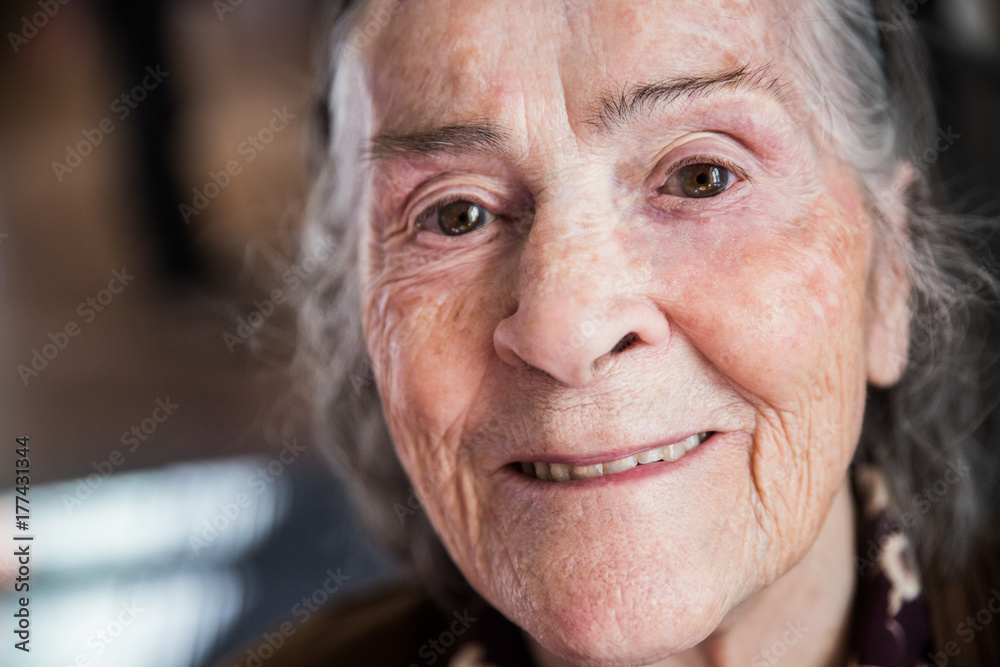 Senior woman smiling portrait looking at camera Senior woman smiling portrait looking at camera