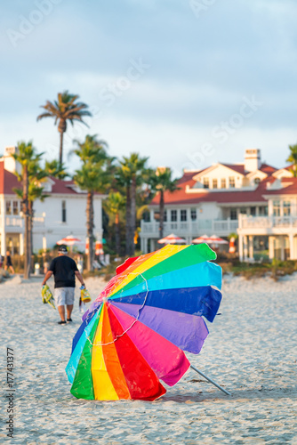 Colourful umbrella on a beautiful beach at sunset © jovannig