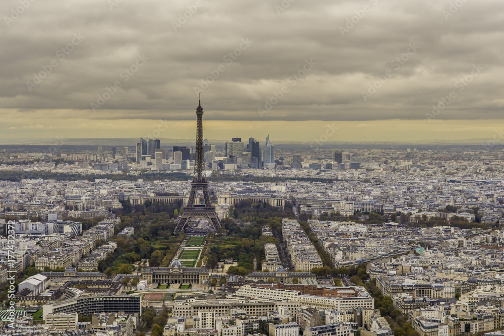 View of Paris Skyline with the Eiffel Tower at Sunset on Overcast Day View of Paris Skyline with the Eiffel Tower at Sunset on Overcast Day