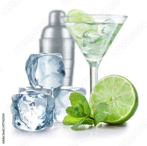 Cocktail, lime, mint and ice cubes and metal shaker isolated on white background	