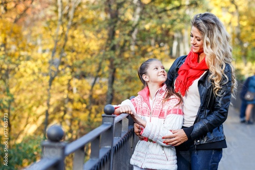 Mother, daughter  having fun in autumn outdoors in the park. Happy family and love concept © Gorodetskaya