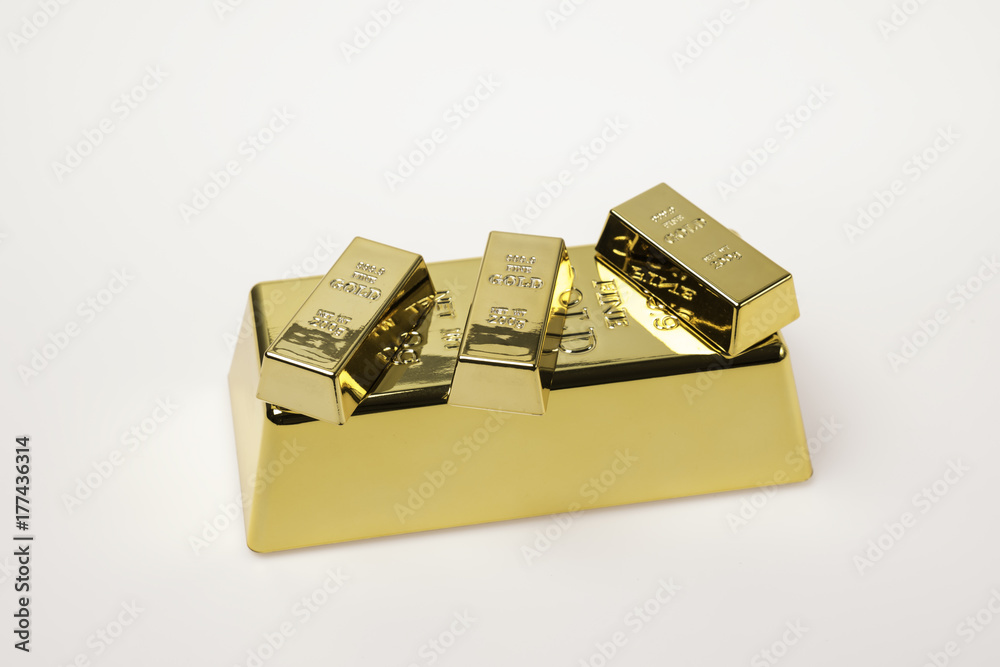 big and small gold bars isolated on white big and small gold bars isolated on white