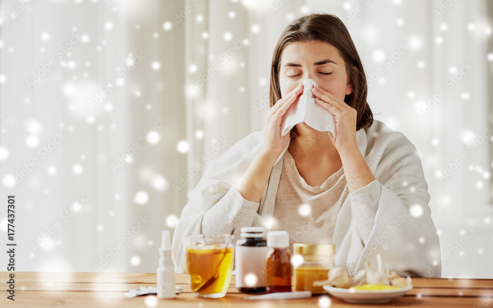 sick woman with medicine blowing nose to wipe sick woman with medicine blowing nose to wipe