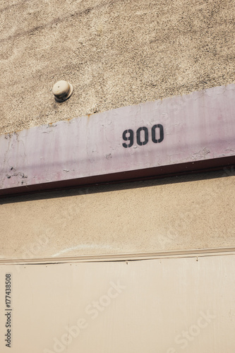 The number 900 on building exterior photo