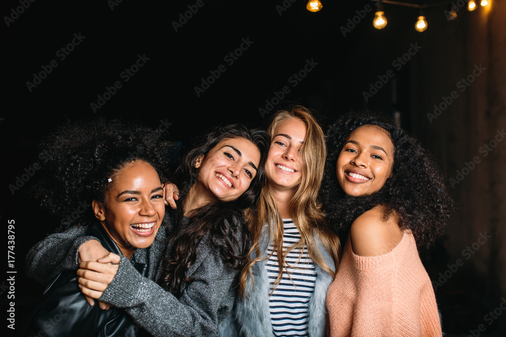 Fototapeta premium Best friends standing outdoors, looking at camera