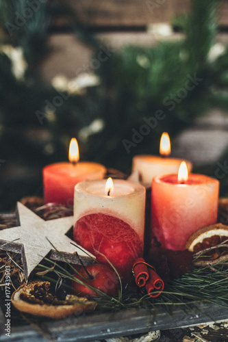 decorated advent wreath with four burning candles photo