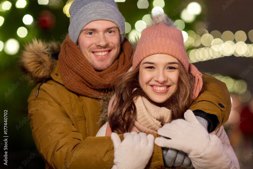 happy couple hugging at christmas tree happy couple hugging at christmas tree
