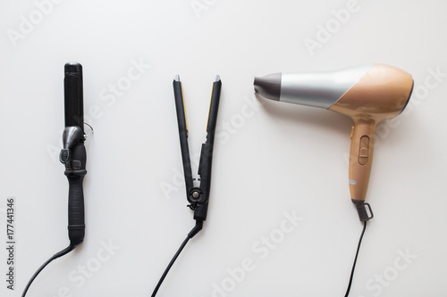 hairdryer, hot styler and curling iron or tongs photo