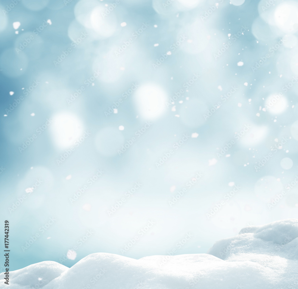 Winter background with snow and blurred bokeh.Merry Christmas and happy New Year greeting card with copy-space. Winter background with snow and blurred bokeh.Merry Christmas and happy New Year greeting card with copy-space.