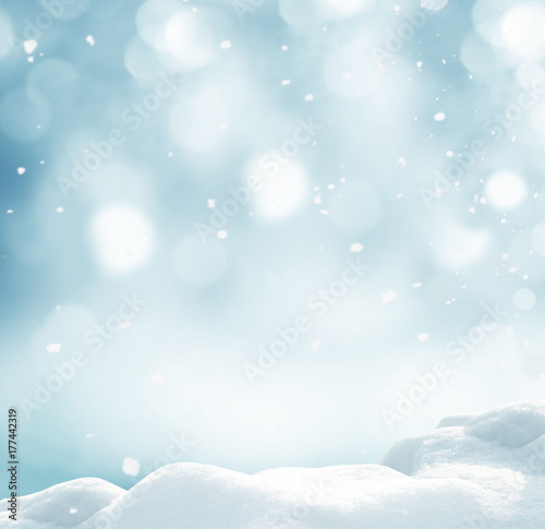 Winter background with snow and blurred bokeh.Merry Christmas and happy New Year greeting card with copy-space.