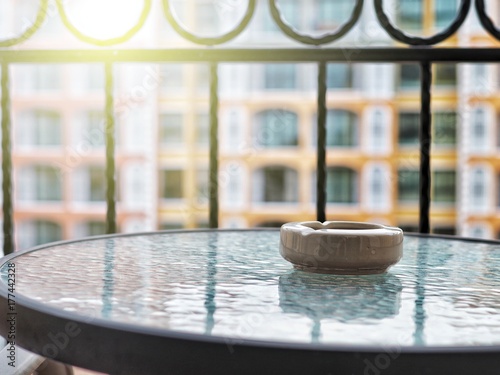 Ashtray on the table at the terrace.