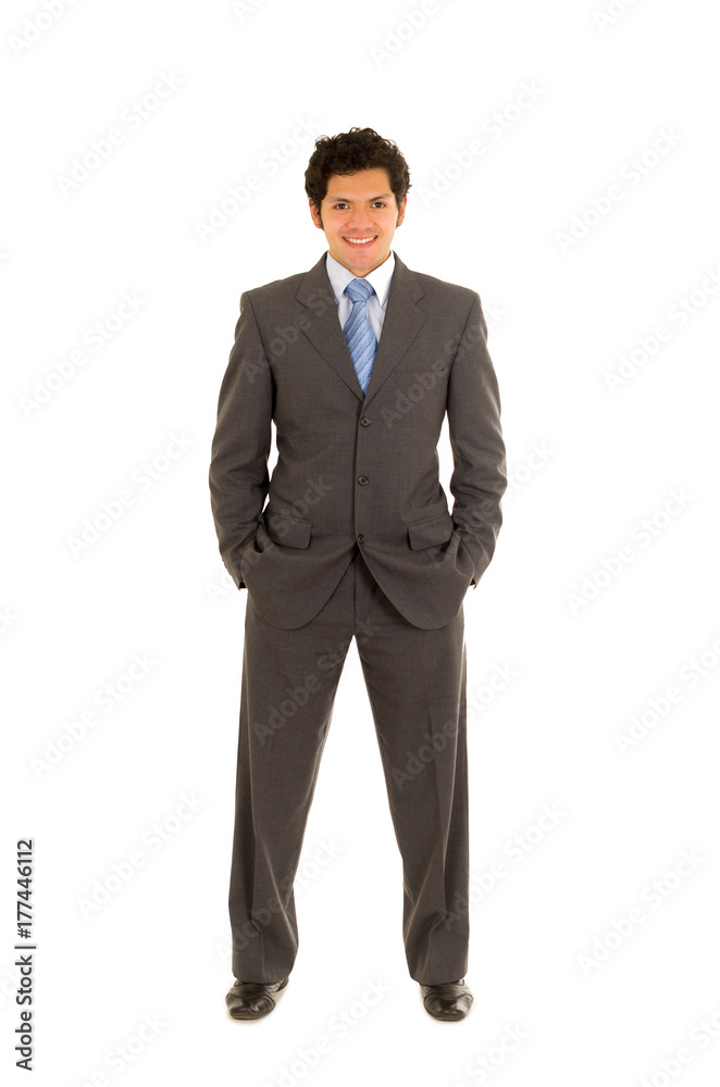 Full length of a handsome young man with curly hair, wearing a nice suit, and posing in a white background Full length of a handsome young man with curly hair, wearing a nice suit, and posing in a white background