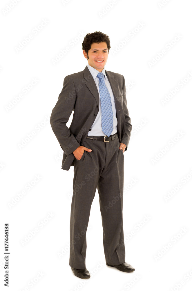 Full length of a handsome young man with curly hair, wearing a nice suit, and posing in a white background Full length of a handsome young man with curly hair, wearing a nice suit, and posing in a white background