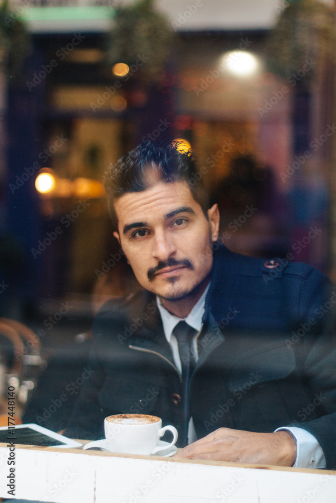 Businessman having a coffee in a bar Businessman having a coffee in a bar