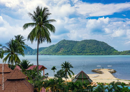 Bungalows in a tropical garden on the beach