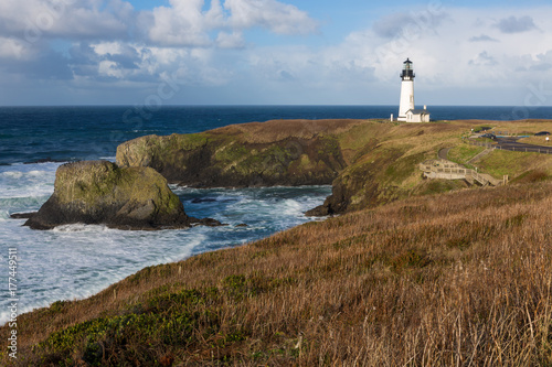 Afternoon clouds roll over Yaquina Head Lighthouse on the Oregon Coast