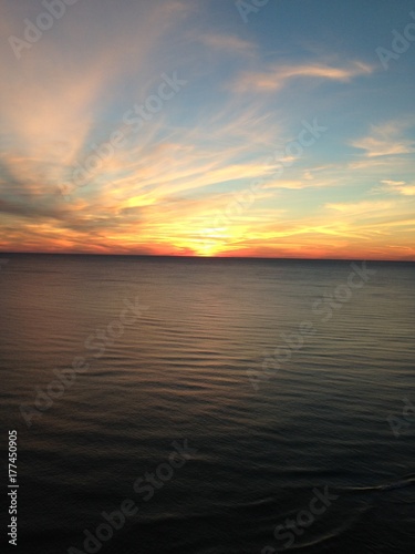 Sunset over the ocean during spring. © Ashley