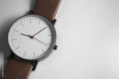 Stylish brown wrist watch on white background.