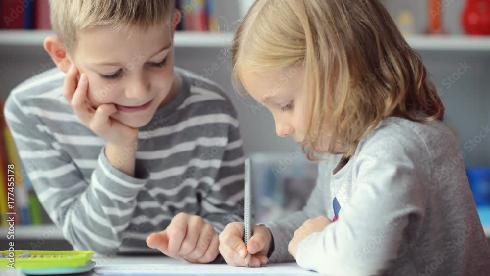 Portrait of two happy children which learning in school Portrait of two happy children which learning in school