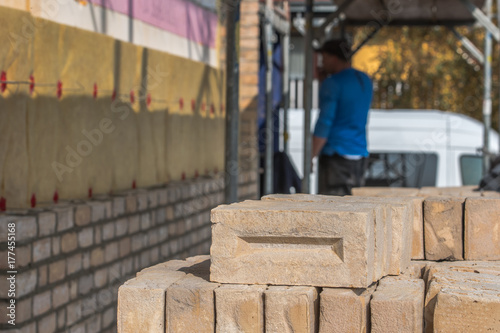 Canvas Print Transport and stacking of bricks, Preparation of the workplace on the constructi