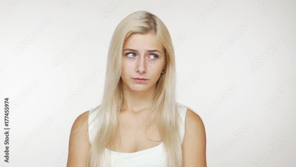 caucasian attractive blondie girl looking at camera pretending to be hurt pouting nodding positively smiling eventually over white background. Concept of emotions caucasian attractive blondie girl looking at camera pretending to be hurt pouting nodding positively smiling eventually over white background. Concept of emotions