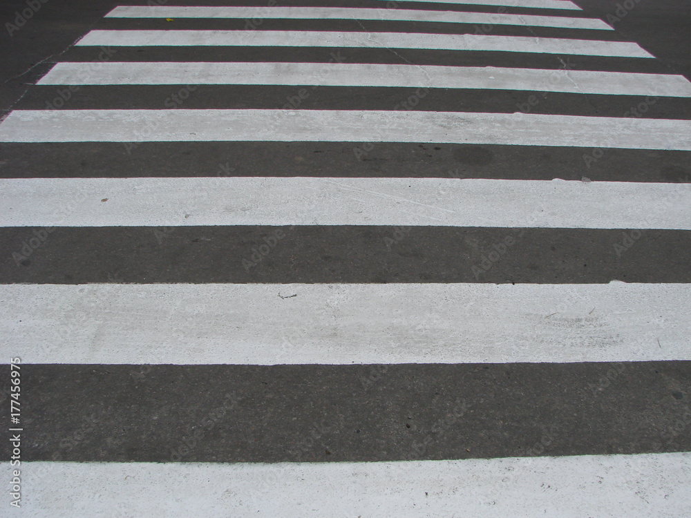 crosswalk on the road for safety when people walking cross the street. crosswalk on the road for safety when people walking cross the street.