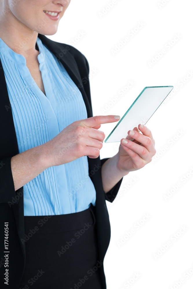 Mid section of smiling businesswoman wearing suit using glass Mid section of smiling businesswoman wearing suit using glass
