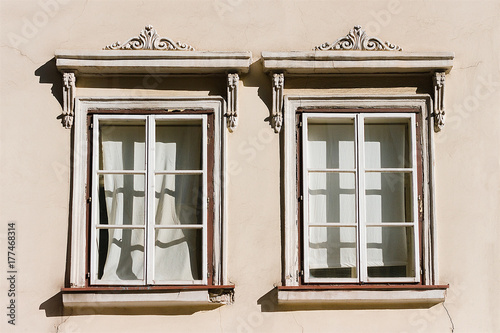 Two white windows with ornaments