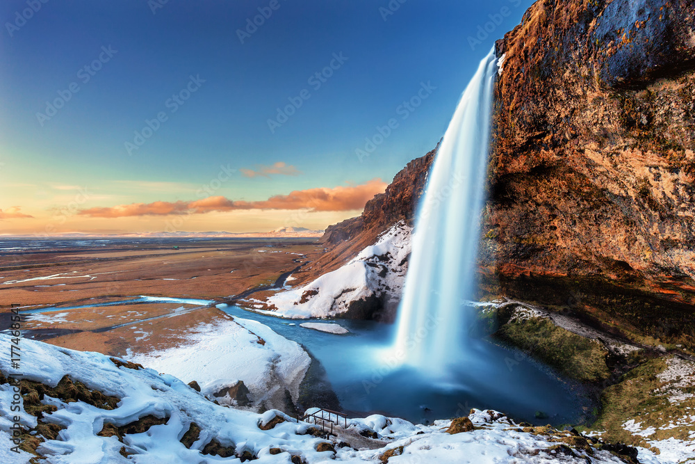 The beautiful Seljalandsfoss in Iceland during winter - obrazy, fototapety, plakaty 