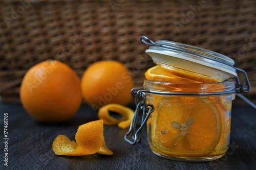 Orange in glass, jam preparetion photo