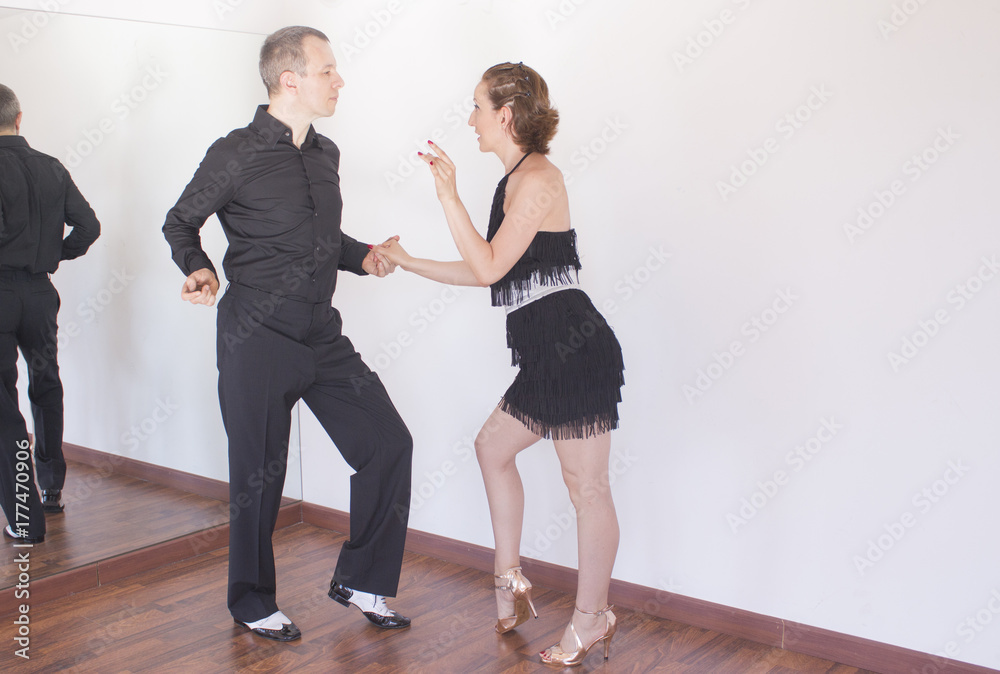 Fototapeta premium Couple of dancers dancing latin dances